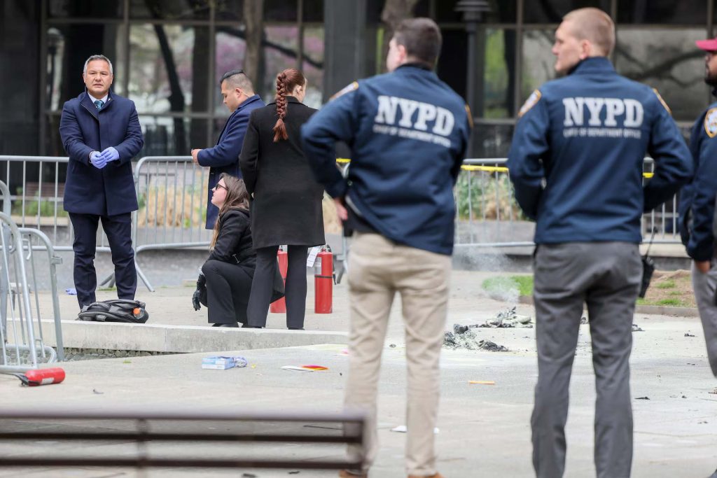 Emergency personnel respond to a report of a person covered in flames outside the New York courthouse where former President Donald Trump's hush-money trial is underway, April 19, 2024. | Brendan McDermid